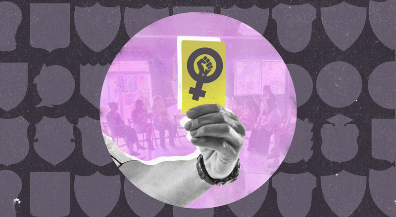 Una tarjeta amarilla con un símbolo que rechaza la violencia de género.